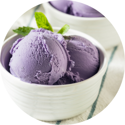 Scoops of purple ube ice cream in a white bowl